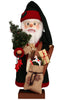 Christian Ulbricht Collectible Wooden Nutcracker - Santa with Christmas Gifts, shaped like Santa holding a small Christmas tree, a burlap sack filled with gifts, a wooden sled, and a toy horse.