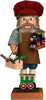 The Christian Ulbricht Collectible Wooden Nutcracker – Railroad Builder Limited Edition 2500 features glasses, a red hat, an apron, and holds a toy train and crate of vegetables while standing on a base with a green train car.