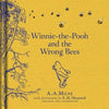 Yellow hardcover of "Winnie-the-Pooh: Winnie-the-Pooh and the Wrong Bees" features Pooh watching bees by a tree branch; illustrated by E.H. Shepard—a delightful classic children’s book.