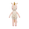 Cuddle + Kind Ella the Unicorn is a plush best friend doll with a pink body, cream horn, cream overalls with pompoms, and embroidered eyes. Each hand-knit doll helps provide meals to children in need.