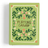 The Green Floral Deck of Playing Cards, shipping in about one week, features a green box with floral patterns and "Playing cards" in artistic lettering—a hand-illustrated design ideal for game enthusiasts.