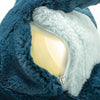 A close-up of the Steiff Light at Night Spott Stegosaurus Stuffed Plush, 11 Inches, shows its blue and white fur with a partially open zipper revealing a smooth yellow plastic interior beneath the fabric.