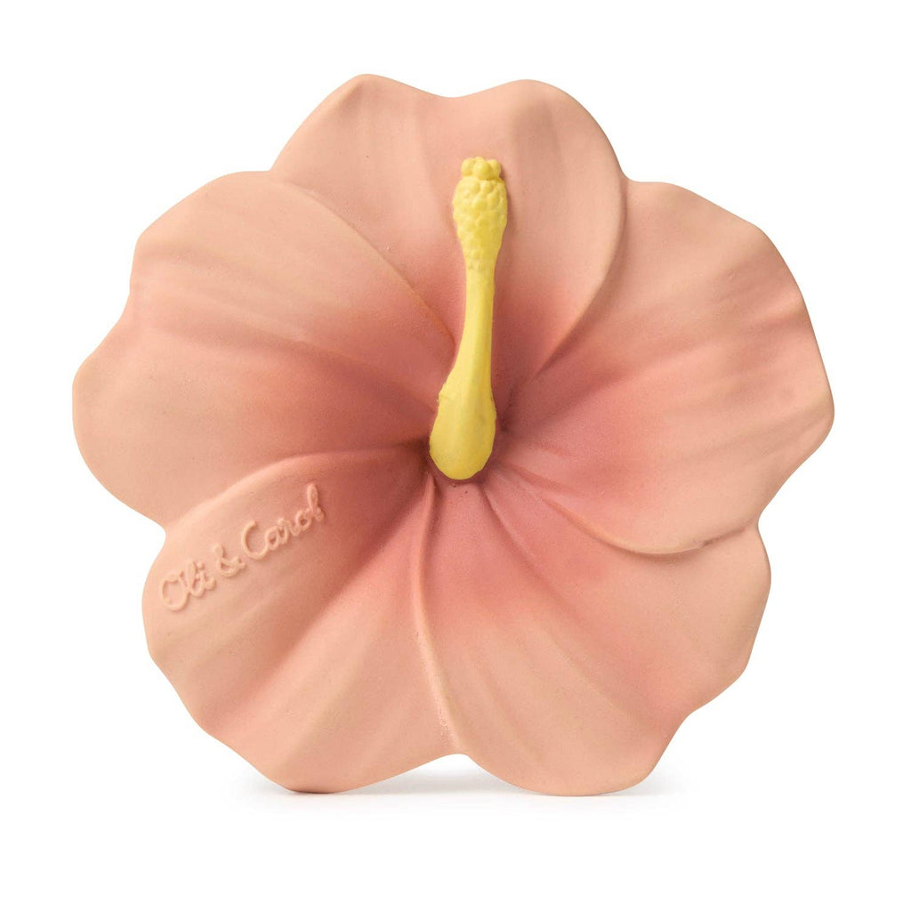 Iris the Hibiscus Teething Toy is a pink, hibiscus-shaped baby teether with a yellow stamen, soft smooth petals, and "Oli & Carol" embossed on one petal. Safe materials make it ideal for infants as a sensory play toy.