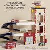 The Fire & Rescue Garage is a wooden playset with ramps, fire engines, an ambulance, a helicopter, and a double-decker bus—perfect for imaginative play and vehicle fans. TV267 London Car Set sold separately.