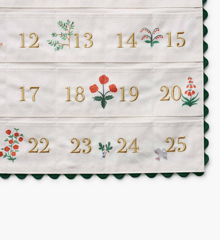Nativity Embroidered Hanging Advent Calendar featuring embroidered numbers 12 through 25 and small floral motifs between each digit.