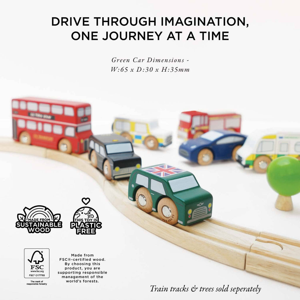 The London Toy Car Set features colorful vehicles, like a green wooden car with a British flag, traveling on wooden tracks. Made from sustainable materials and plastic-free. Train tracks and trees are sold separately.