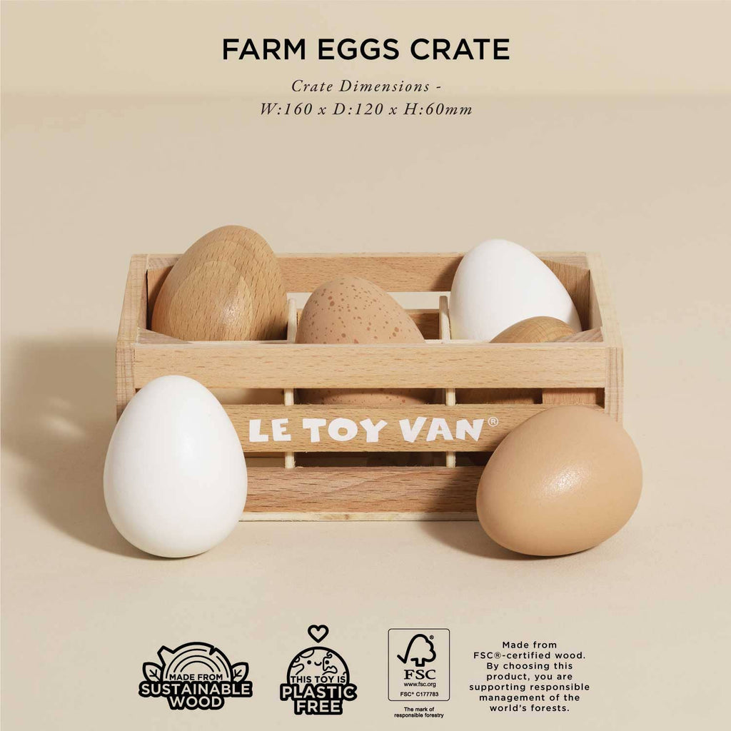 The Farm Eggs Wooden Market Crate holds six realistic wooden eggs in shades of brown and white. Made from sustainable, plastic-free FSC certified wood. "Le Toy Van" is labeled on the crate. Dimensions provided above.