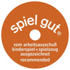 A round orange "spiel gut" label, with white text and a small center hole, is often found on handcrafted wood toys like the Holztiger Piglet (ships in one week), signifying recommendation by the arbeitsausschuß kinderspiel + spielzeug.