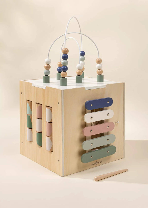 The Wooden Activity Cube is a delightful toddler toy with pastel beads, rotating blocks, and a xylophone—ideal for developing fine motor skills in green, pink, blue, and beige.