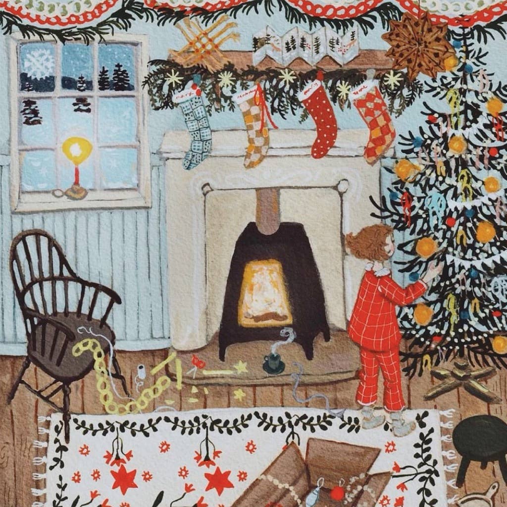 A child in red pajamas decorates a Christmas tree beside a fireplace with hanging stockings, featured in the Merry and Bright - 500 Piece Jigsaw Puzzle.