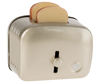 The Maileg Toaster with Bread, Large Size - Silver, is a metallic children's kitchen toy featuring two toy bread slices popping out. Viewed at an angle, its front lever and round button are clearly visible.