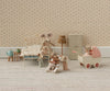 A charming dollhouse scene features mouse dolls in pajamas—some on a soft mattress bed, some with a blanket, and one pushing baby mice in the Maileg Pram, Mouse - Coral. The room has tiny furniture and floral wallpaper.