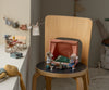 A cozy scene features three small mouse figurines: two near a toy bed on a chair, one by a picnic table on the windowsill, with a toy laundry line nearby. Plush toys and the Maileg Happy Camper Tent in rust complete the sleepover vibe.