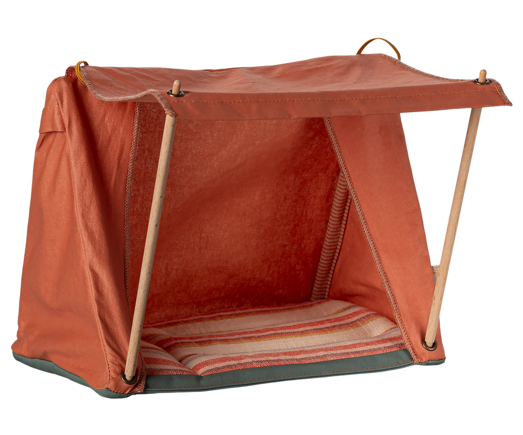 The Maileg Camping Set features a charming tent with an orange fabric, supported by wooden poles, and a striped base. Its open front design is ideal for displaying small toys or models, especially when combined with the delightful Maileg Bonfire Set.
