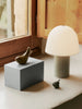The Ferm Living Hand Carved Wooden Harbour Box - Fish sits on a windowsill with FSC certified aspen wood frames, next to a ceramic bird figurine, a small decorative object, and a white lamp with a pleated shade.