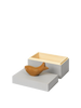 The Ferm Living Hand Carved Wooden Harbour Box - Fish features a wooden fish figurine on its rectangular, light gray lid with a natural wood interior—an ideal decorative touch for any children's room.