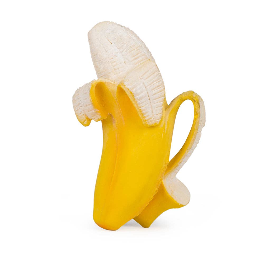 The Ana Banana Teether is a realistic yellow banana toy, partially peeled to show the white fruit inside. Designed from natural rubber, it stands upright on a plain background—ideal for babies’ sensory play.