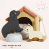 The Dolls House Pet Set includes a wooden doghouse with a red roof, black dog and white cat figurines, a light blue food bowl, and features "DOLL HOUSE SCALE 1:12" on a bright background—ideal for imaginative play.