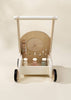 The Wooden Activity Walker, featuring a spinning wheel, shape sorter blocks, and four black wheels, is photographed against a cream background.