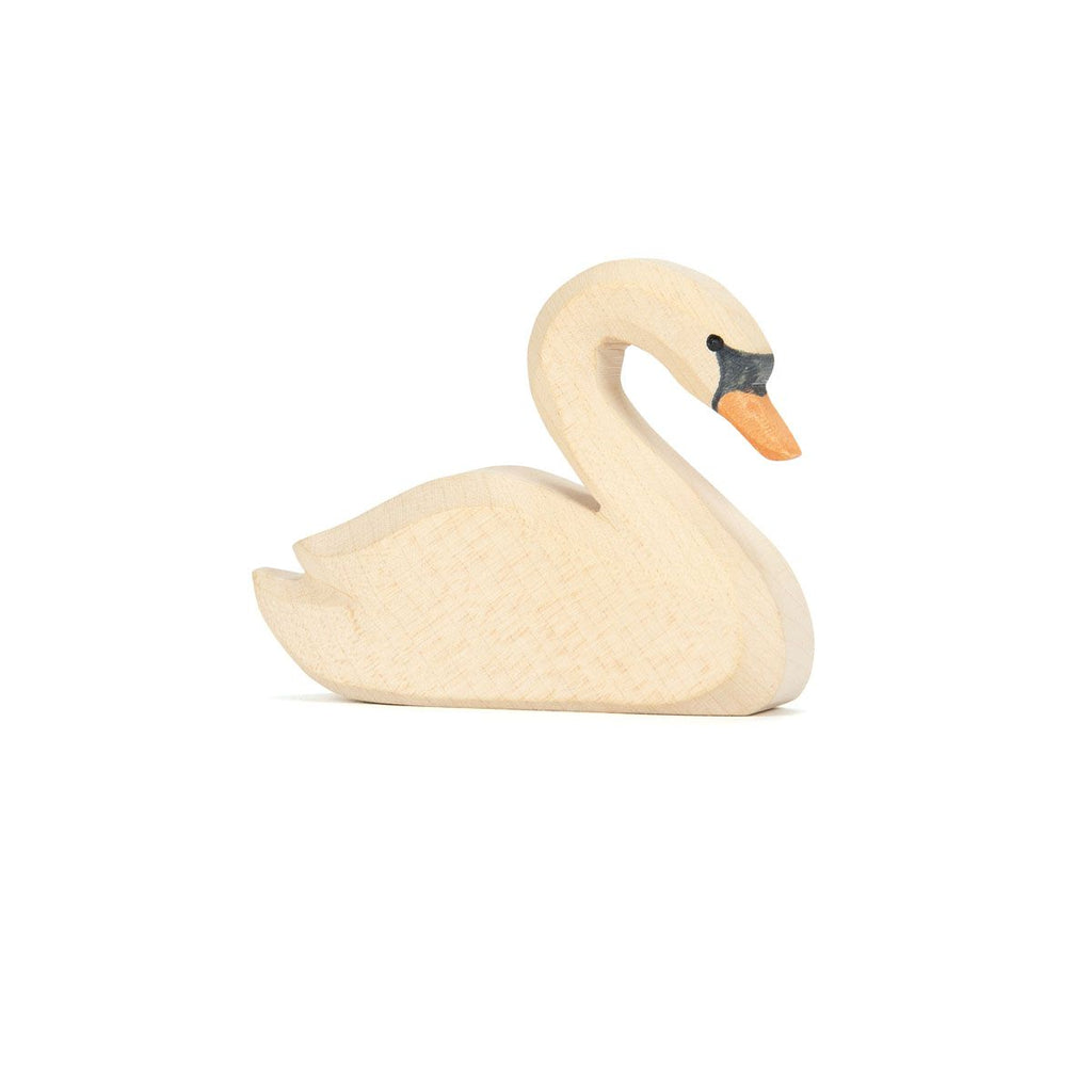 The Ostheimer Swan is a handcrafted wooden toy with a light wood finish, orange beak, and black eye markings. Made from non-toxic materials, it's inspired by classic Ostheimer toys and shown on a white background.