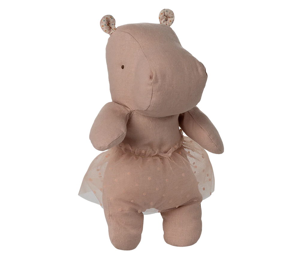 The Maileg Small Hippo With Skirt Stuffed Animal - Soft Rose stands upright against a neutral background, showcasing its plush design, soft rose color, and delicate polka dot ballerina skirt from the Safari friends collection.