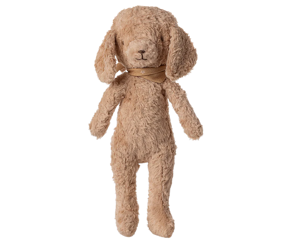 The Maileg Poodle Dog, Vintage Plush in Dusty Powder stands upright against a plain background, featuring floppy ears, a fuzzy light brown coat, and a tan scarf around its neck.