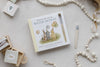 Winnie-the-Pooh: Pooh’s Birthday Surprise (Water Reveal) book featuring Pooh and his friends with balloons, a water pen, wooden beads, and small illustration cards for a no-mess activity.