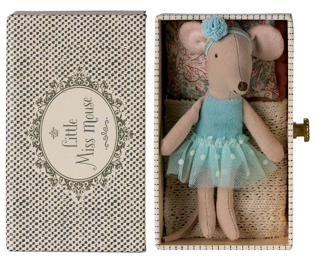 A Maileg Dance Mouse in a mint dress, Little Sister size, rests in a decorative daybed box featuring patterned sides and cozy bedding.