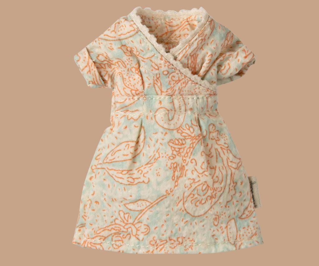 A small, light blue and peach dress with short sleeves features an intricate floral pattern and a V-neckline with lace trim, capturing the elegance of the Maileg Mom Mouse With Extra Outfit - Petite Couture's pink skirt against a plain background.