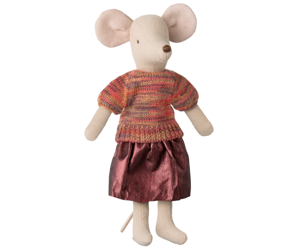 A plush toy mouse featuring Maileg's Skirt and Knitted Blouse for Mum Mouse, an ensemble with a multicolored sweater and shiny pink skirt, stands against a plain background. The mouse's large pink ears and small tail add to the charm of its adorable outfit. Ships in one week.