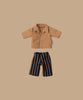 The Maileg Dad Mouse With Extra Outfit includes a small brown collared floral shirt and black pants with vertical brown stripes on a beige background, adding style to Dad Mouse's wardrobe.