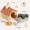 The Dolls House Pet Set includes a small wooden kennel, cat figure on the roof, scratch post, food bowl, and a dog on a gray cushion. Each labeled piece is part of this 6-piece set for imaginative play.