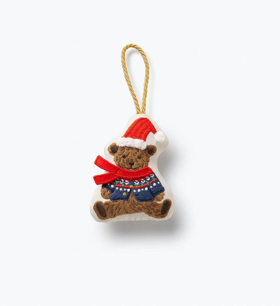 Beary Christmas Embroidered Ornament shaped like a bear wearing a Santa hat, a red scarf, and a patterned blue sweater, featuring a gold cord loop for hanging.
