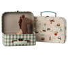 The Maileg Suitcase Set, 2-Pieces - Pony includes a green-and-white checkered suitcase with a toy horse and a second case featuring a countryside print. Both have light handles and metal clasps.