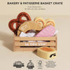 The Bakery & Patisserie Wooden Market Crate includes eco-friendly, plastic-free wooden toy pastries—pretzel, croissant, heart cookies, and a pink-frosted treat—in a charming crate labeled "LE TOY VAN" with dimensions provided for pretend bakery play.