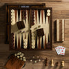 The Heirloom Edition: 7-in-1 by WS Game Company includes chess, checkers, backgammon, cribbage, poker dice, cards, and dominoes in a stylish walnut cabinet for elegant game nights.