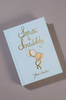 The Sense and Sensibility | Collector's Edition | Hardcover Book by Jane Austen has a light blue cover with gold script and three intertwined balloon illustrations, shown in a photo on a gray background.