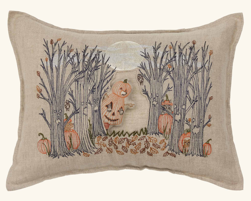 The Coral & Tusk Spooky Forest Pocket Pillow features a pumpkin-headed figure, bare trees, fallen leaves, pumpkins, and a glowing full moon—perfect for Halloween decor.