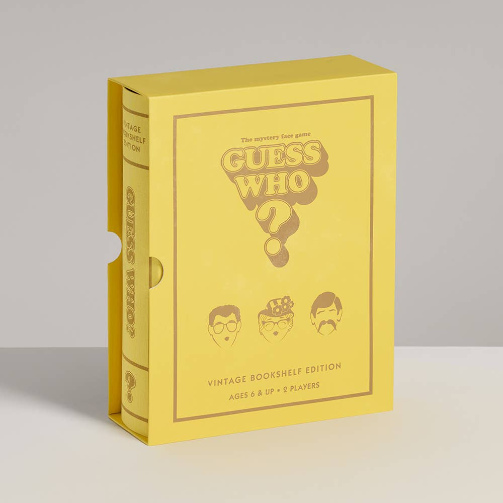 A yellow box for Board Game: Guess Who? Vintage Bookshelf Edition stands upright, displaying cartoon face cards, the game logo, and text for ages 8+ and 2 players.