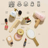 A flat lay of the Vanity Star Beauty Kit, a wooden makeup set with pretend toys like a perfume bottle, hair comb, blusher, and lipstick. Icons show it boosts imagination and social skills—ideal for any kid’s beauty bag.