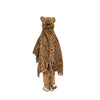 A child faces away wearing the Costume - Leopard, a faux fur hooded cape with ears and tail, over tan pants and white shoes, set against a white background.