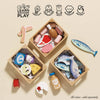 The Market Fish Wooden Play Market Crate is filled with toy food like cheese, eggs, fruit, and fresh fish. Icons highlight creativity, coordination, social skills, imagination, and dexterity. Perfect for pretend play; crates sold separately.