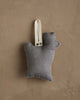 The Coral & Tusk Rudolph Ornament is a small, gray fabric stuffed toy shaped like a hand with a raised index finger and a white loop—a cute Christmas tree decoration—shown against a textured beige background.