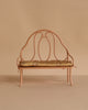 Small Maileg Medium Mouse Set vintage metal bench with a curved backrest and a floral patterned cushion.