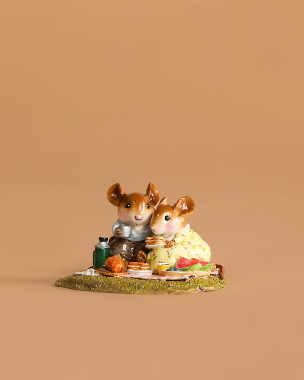 The Wee Forest Folk Tiny Collectible - Just the Two of Us (Not a Toy) features two handmade mouse figurines in charming outfits enjoying a picnic on a blanket with food and drinks, set against a simple light brown background.