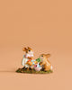 The Wee Forest Folk Tiny Collectible - Baskets Full of Easter Joy features a handmade mouse in a polka-dot dress with a basket, standing beside a rabbit and another basket on a green base against a peach background.