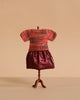 A Maileg Mum Mouse mannequin models the Extra Clothing set—featuring a multicolored knitted blouse and shiny burgundy skirt—against a plain beige background.