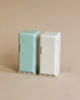 Two Maileg Miniature Fridges, one mint green and one white, each labeled "maileg," standing together against a neutral beige background. These are models from the House of Miniature collection.