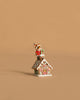 The Wee Forest Folk Tiny Collectible - Santa's Gingerbread House features a hand-sculpted mouse in a red outfit atop a snow-covered gingerbread house—an adorable piece for miniature collections.