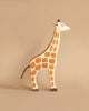 Holztiger Handmade Wooden Safari Animals Set giraffe toy with a painted brown spot pattern and a rope tail.